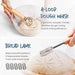 Bread making tools including a 4-loop dough whisk and a bread lame on a white background.