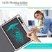 LCD writing tablet with a hand drawing on it, used by a woman in an office setting.