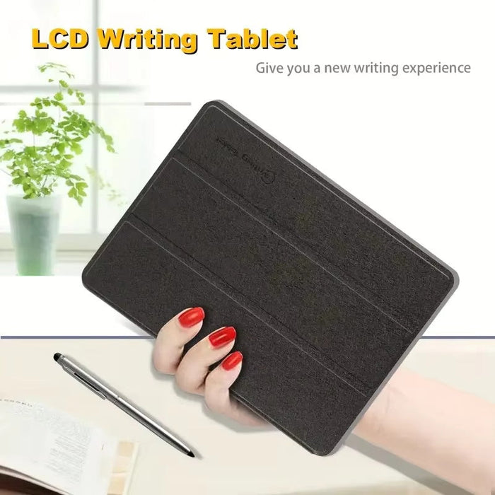 Black LCD writing tablet held by a hand with red nails, placed on a surface with a pen and paper.