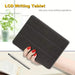 Black LCD writing tablet held by a hand with red nails, placed on a surface with a pen and paper.