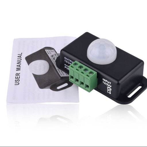Pir motion sensor with user manual on a white background