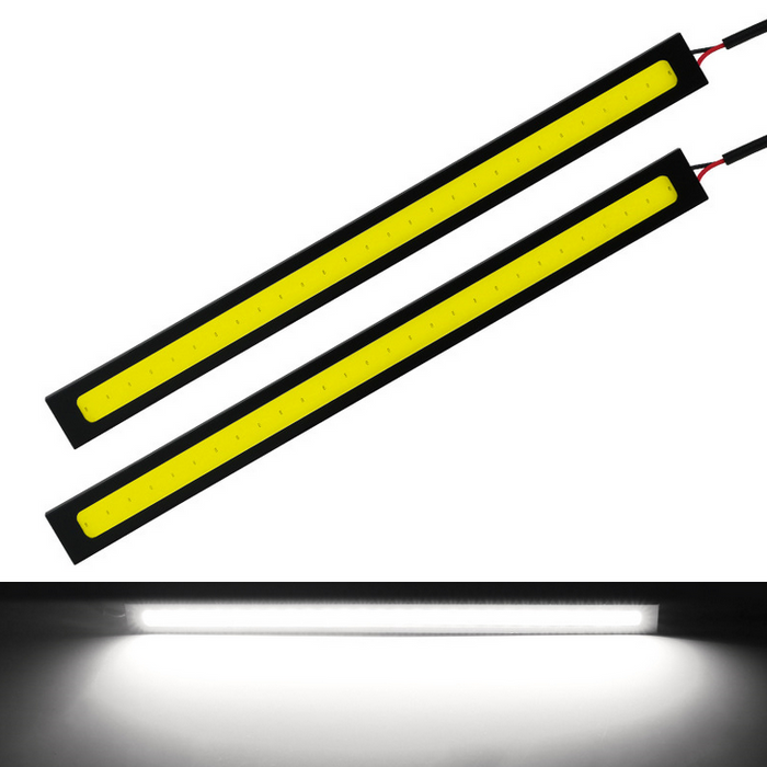 Two yellow LED strips with black frames on a white background, one showing light emission.