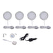 Set of four round LED puck lights with mounting hardware on a white background