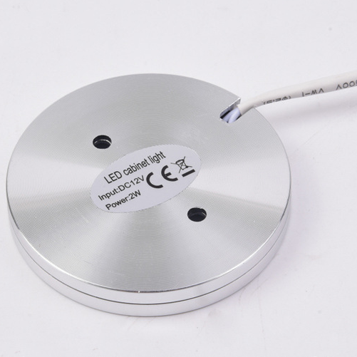 Silver LED cabinet light with label on a white background