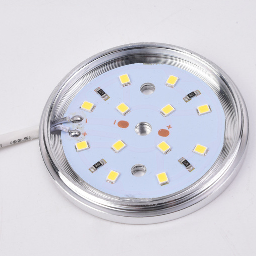 Close-up of a LED light bulb with visible components on a white background