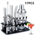 Set of 17 cocktail-making tools on a stand with a glass of red cocktail and lime garnish.