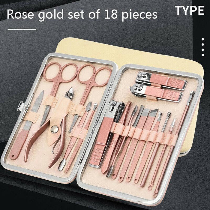 Rose gold manicure set with tools in a case on a black background