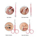 Set of pink nail care tools including a cleaner, pusher, scissors for eyebrows and nose hair on a white background.