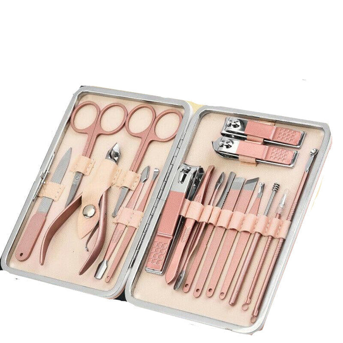 Manicure set with pink tools in a case on a white background