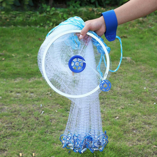 Fishing net held by a person outdoors on grass