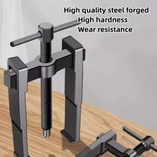 Metal tool with text highlighting high quality steel, hardness, and wear resistance on a wooden surface.