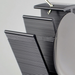 Close-up of a ceiling light fixture with black pleated shade and white lampshade.
