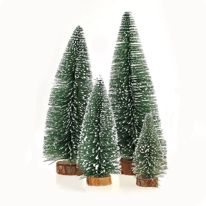Set of three artificial Christmas trees with snow effects on a white background