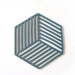 Hexagonal trivet with a geometric pattern on a white background