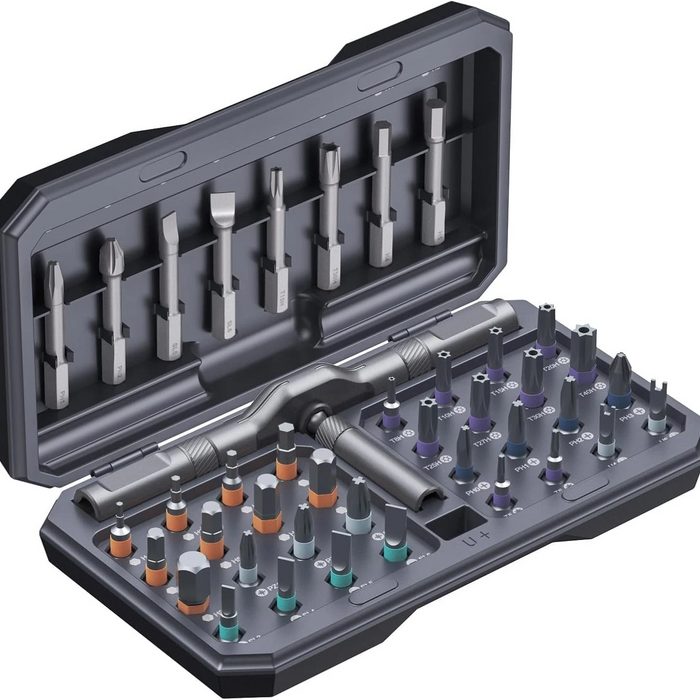 Set of drill bits and accessories in a gray case on a white background