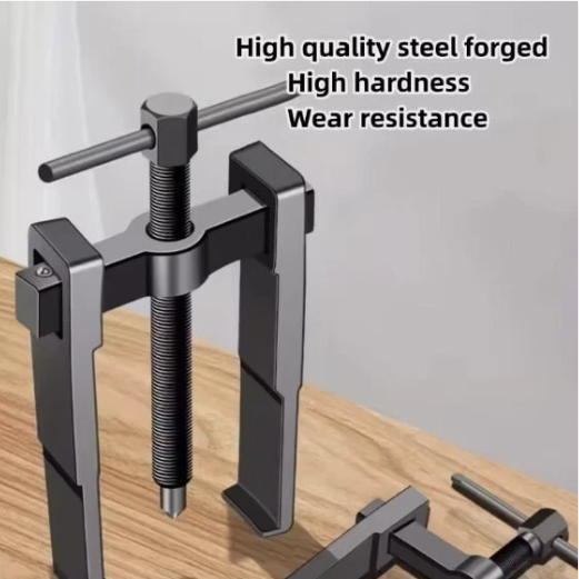 Metal tool with text highlighting high quality steel, hardness, and wear resistance on a wooden surface.