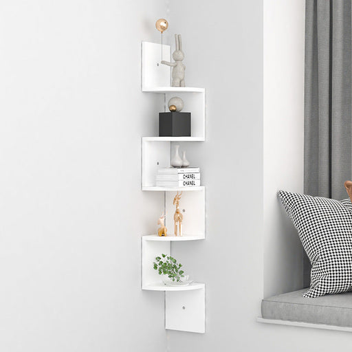 White corner shelf with decorative items against a light gray wall.