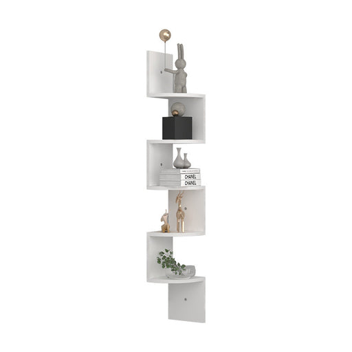 White corner shelf with decorative items on a white background