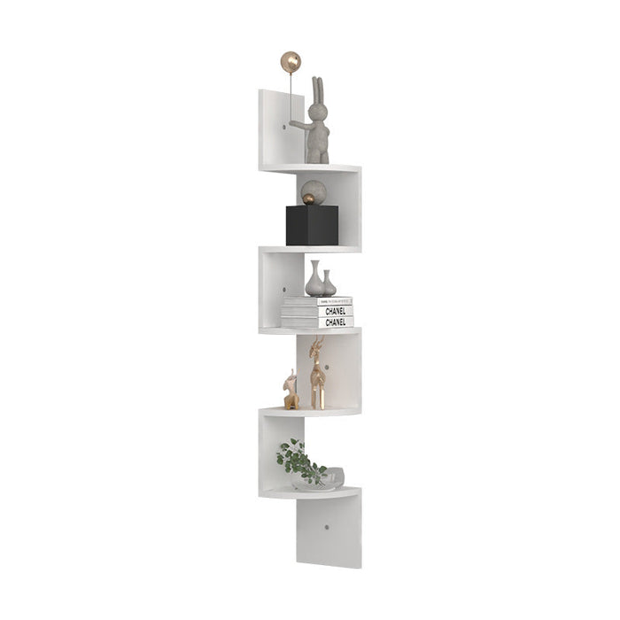 White corner shelf with decorative items on a white background