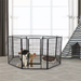Pet playpen with a dog inside in a room with a striped tent and toys.