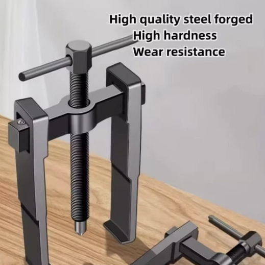 Metal tool with text highlighting high quality steel, hardness, and wear resistance on a wooden surface.