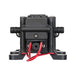 Black mechanical pump with red and black wiring on a white background