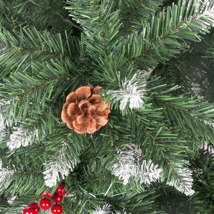 Close-up of a Christmas tree branch with pine cones and red berries.