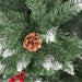 Close-up of a Christmas tree branch with pine cones and red berries.