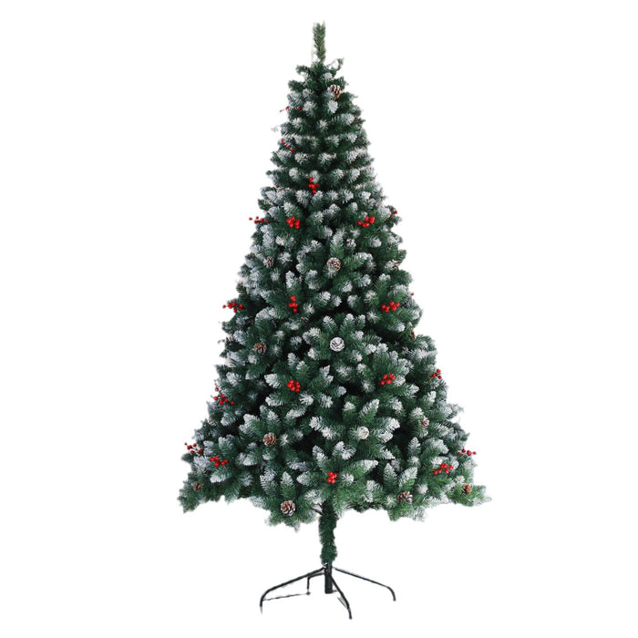 Decorated artificial Christmas tree with red berries on a white background