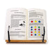 Open book with colorful diagram on a stand against a white background