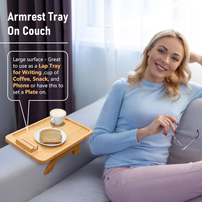 Woman sitting on a couch with an arm tray.
