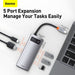 Baseus 5-port expansion device with cables and USB drives on a white background