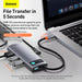 Baseus USB hub connected to a laptop with text highlighting file transfer speed.