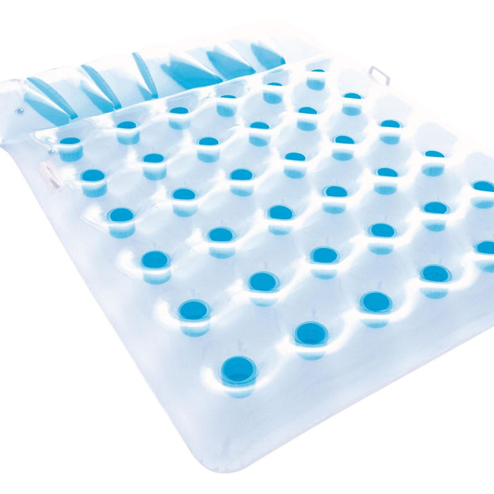 Silicone mold with blue silicone balls on a white background
