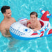 Man and child in a pool with an inflatable plane float.