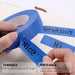 Blue tape with text being peeled off, showing tearable and writable properties.