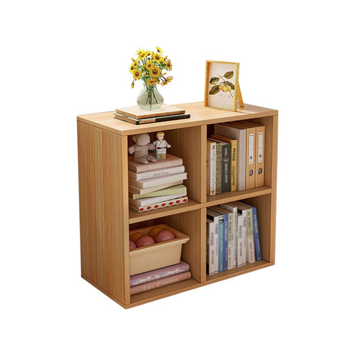 A wooden cubes storage bookcase organizer with multiple compartments, filled with books, decorations, and office supplies.