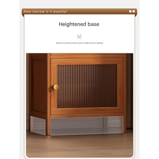 A one-tier bamboo storage cabinet with clear acrylic doors and a heightened base, displayed in a home setting.
