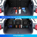 Car trunk with organized compartments and tools, with text about saving trunk space.
