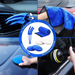 Collage of car care products including gloves, towel, applicator, and pad with a central logo.