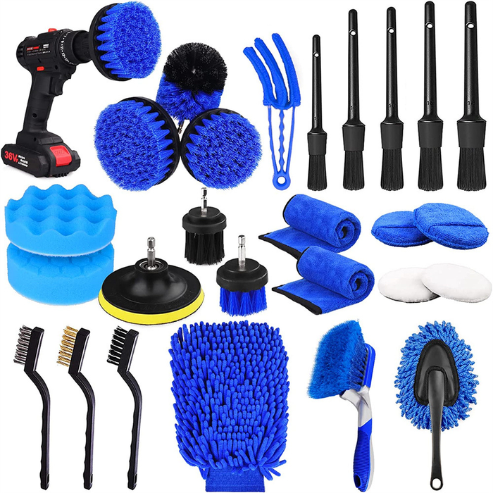 Collection of car cleaning tools including brushes, sponges, and a drill on a white background