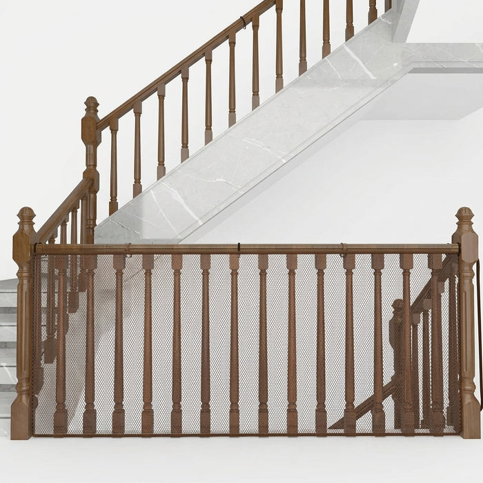 A brown wooden stair gate with a mesh safety net, installed across a staircase with a white marble-tile step and matching wooden handrails.