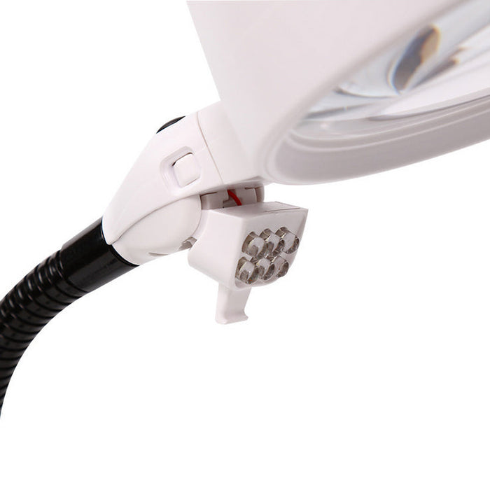 Close-up of a white magnifying glass with black hose on a white background