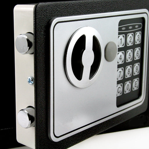 Close-up of a digital safe lock with keypad on a black background