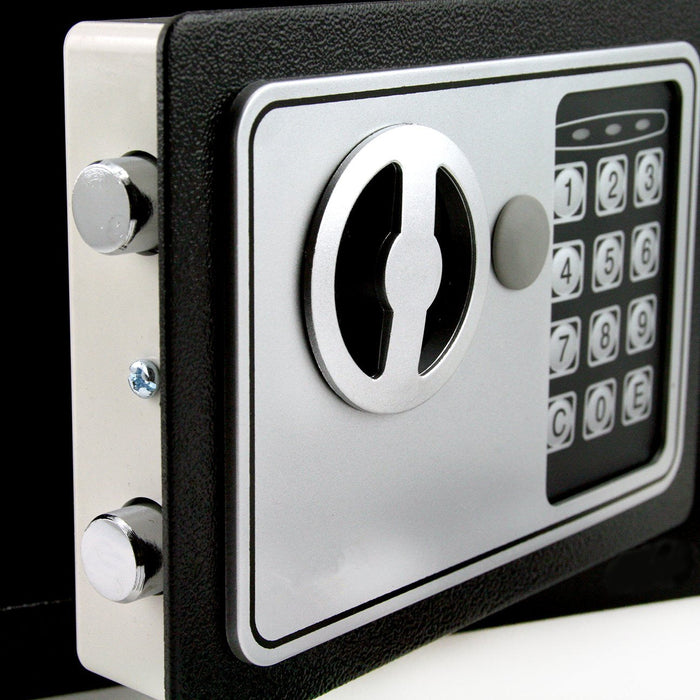 Close-up of a digital safe lock with keypad on a black background