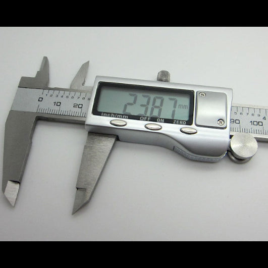 Digital caliper measuring a small round object on a white background