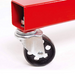 Close-up of a red metal frame with a black wheel on a white background
