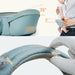 Baby carrier with measurements and a person using it, on a white background