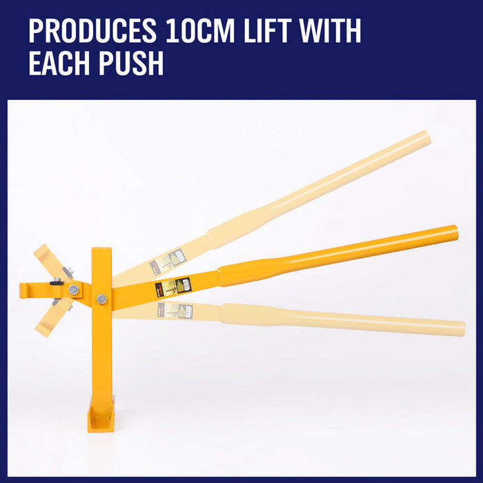 Yellow mechanical device with wooden handles on a white background, labeled 'PRODUCES 10CM LIFT WITH EACH PUSH'.