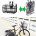 Bicycle with a rear-mounted basket and an additional basket attached to it on a sidewalk.